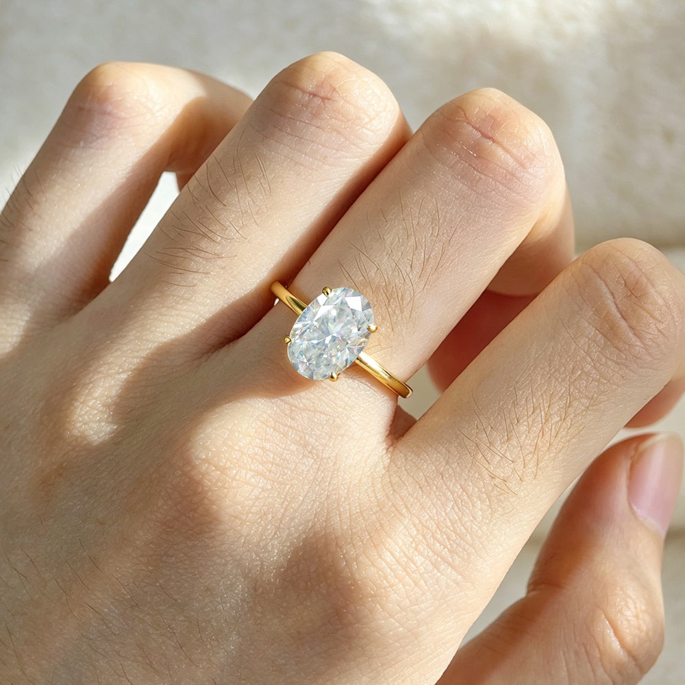 Polished Smooth Band Four-Prong Oval Cut Solitaire Moissanite Ring Set
